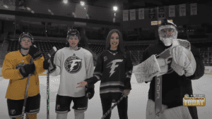 North Dakota Today Sophia Richards with Fargo Force players on the ice