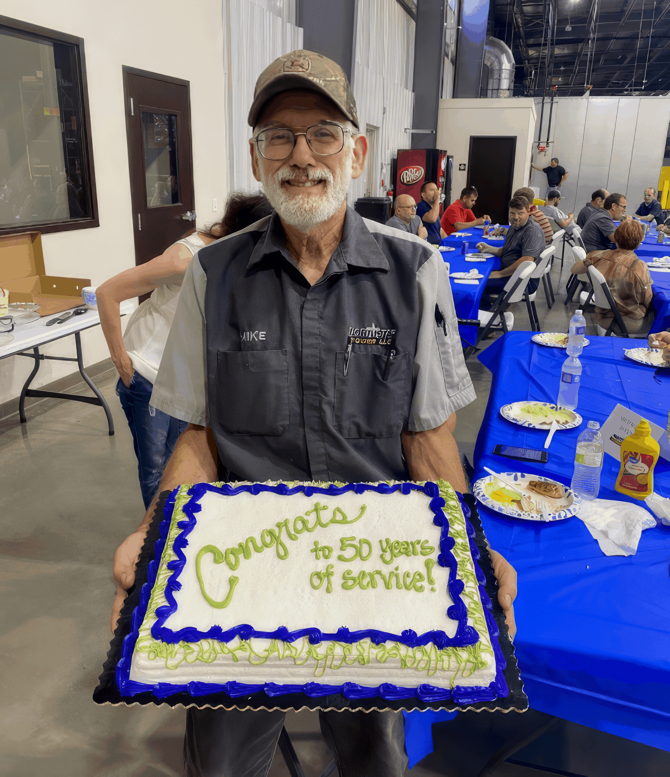 Mike Wagner with 50th Work Anniversary cake
